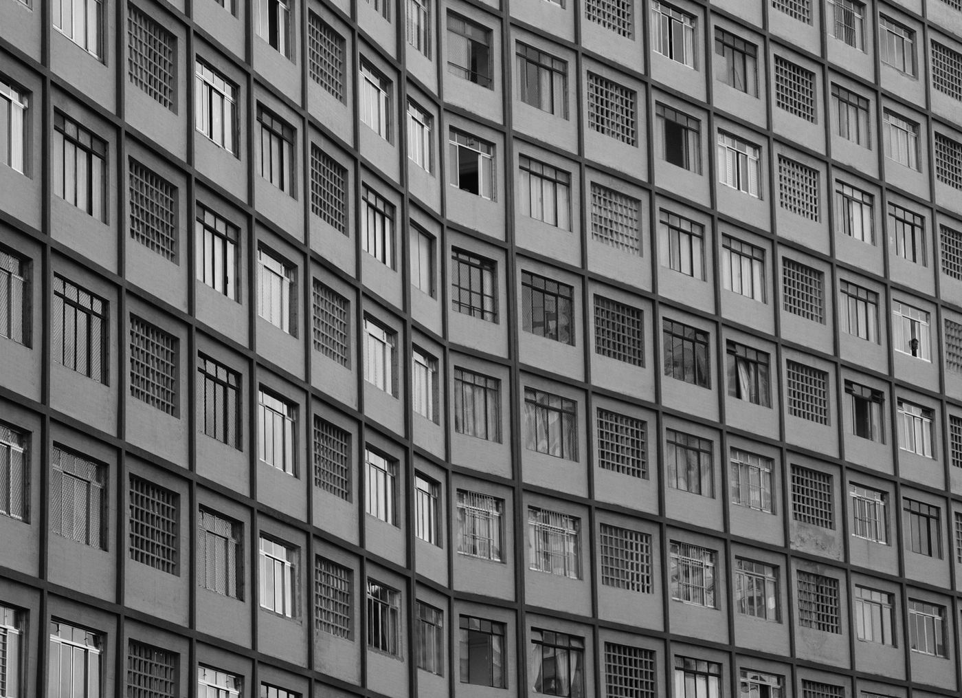 Monochrome geometric building facade with square windows