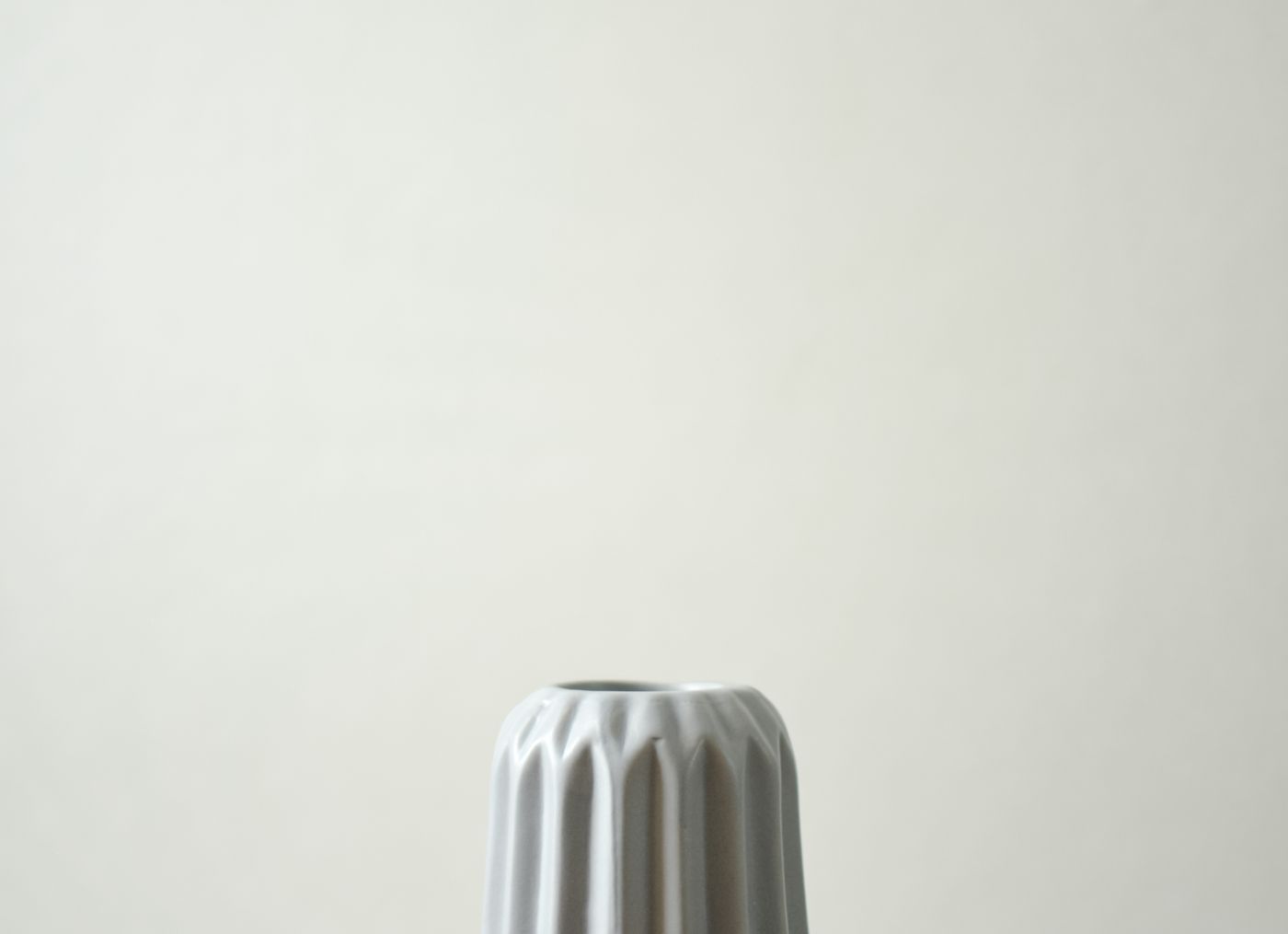 Ceramic vase on a concrete box in a neutral interior