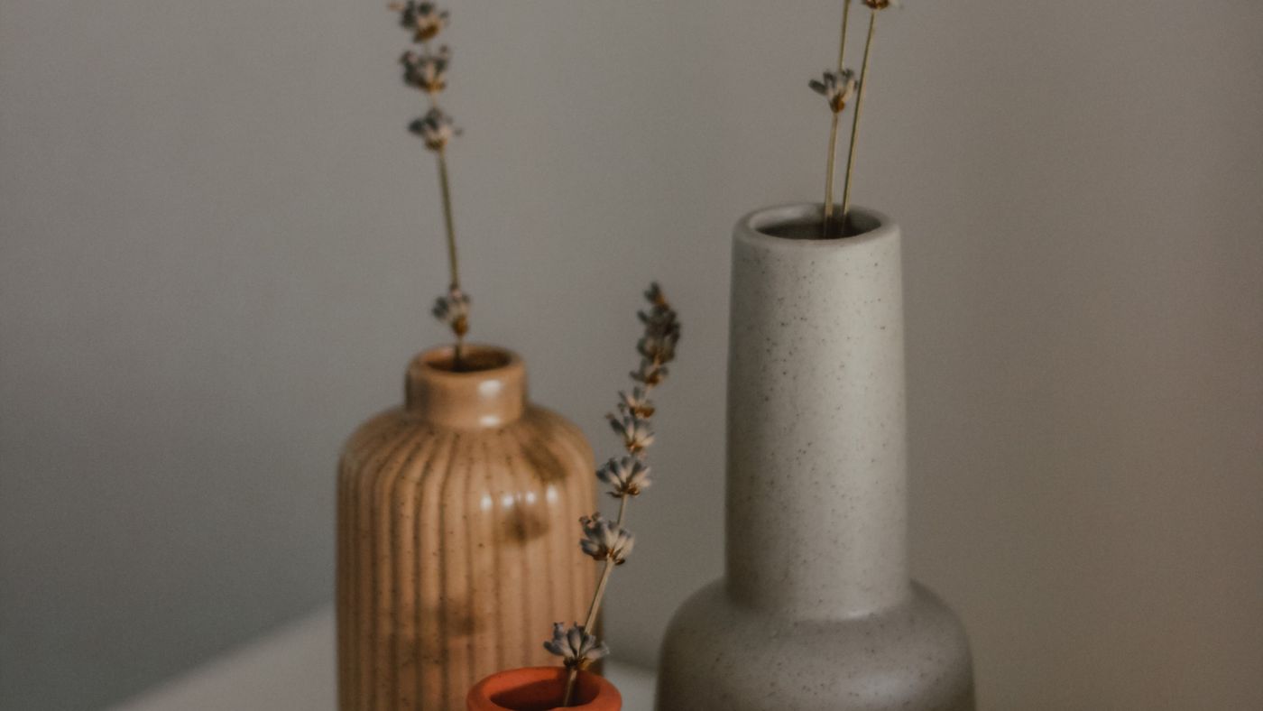 Still life of ceramic vases with dried flowers