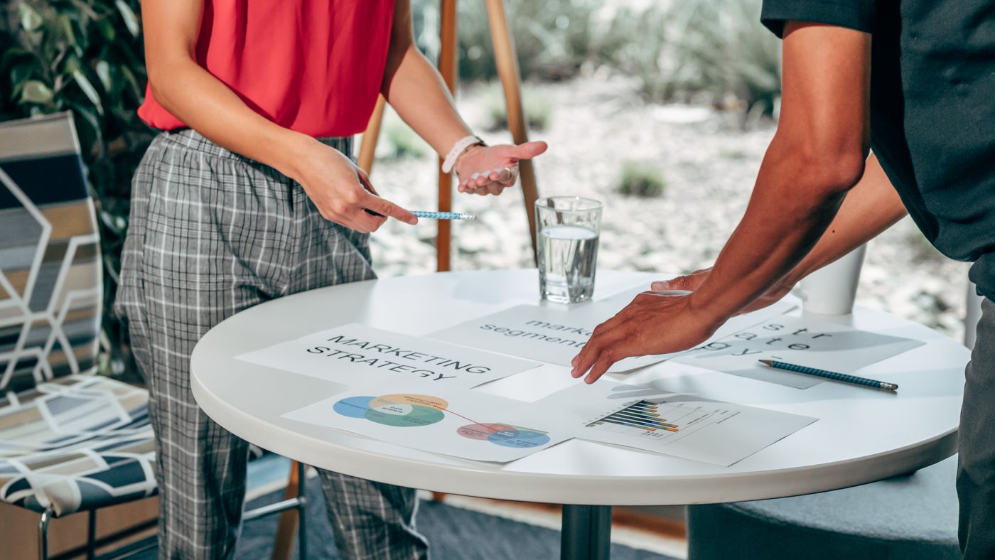 Colleagues collaborating on marketing at a workspace